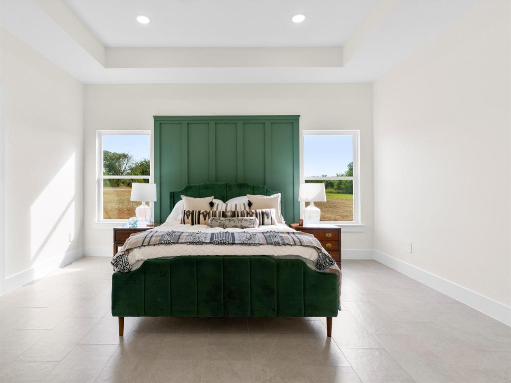 1623 County Road 4764 Boyd, TX 76023 - Photo 10 of 29 a bedroom with a bed and a window