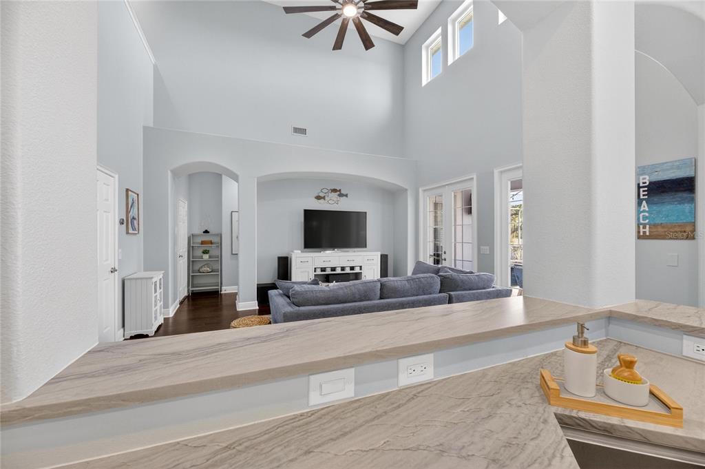 5721 Sea Turtle Place Apollo Beach, FL 33572 - Photo 20 of 80 a living room with furniture and a flat screen tv