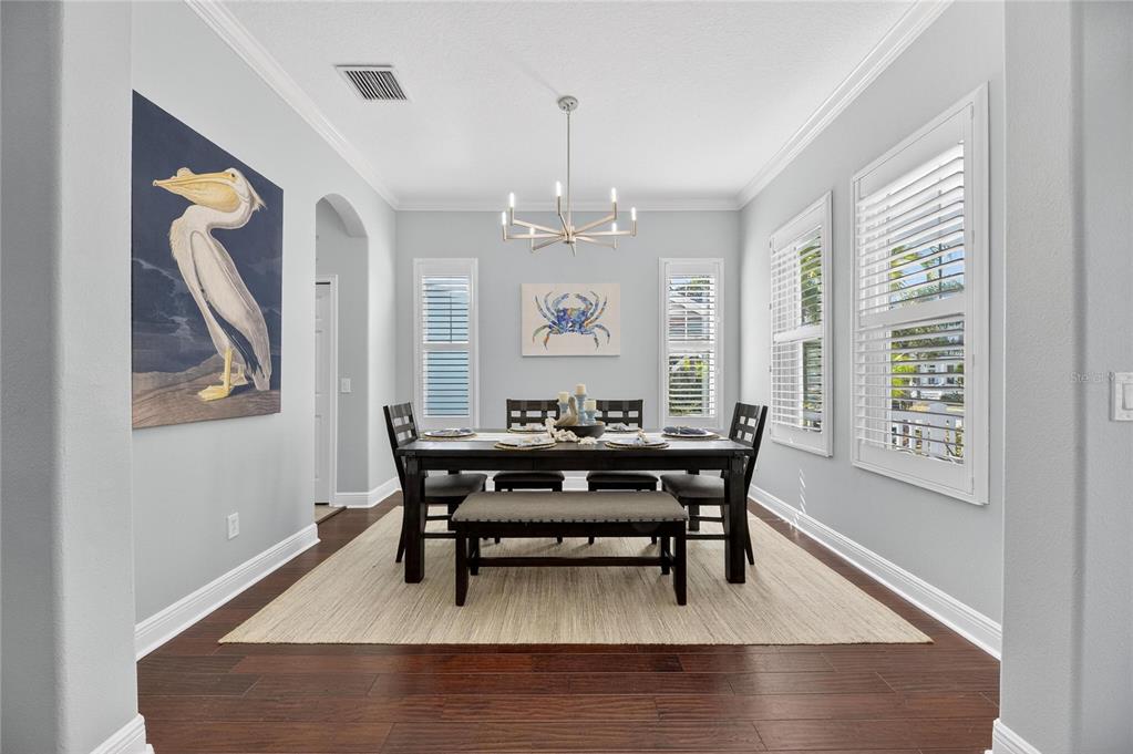 5721 Sea Turtle Place Apollo Beach, FL 33572 - Photo 24 of 80 a view of a dining room with furniture window and wooden floor