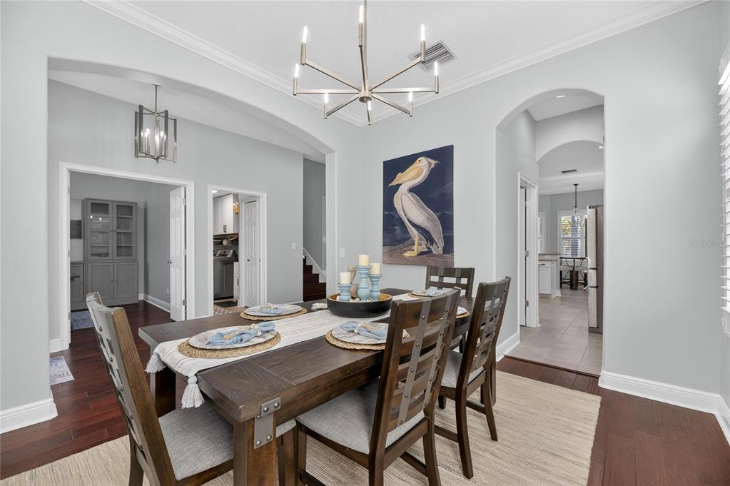 5721 Sea Turtle Place Apollo Beach, FL 33572 - Photo 25 of 80 a view of a dining room with furniture and wooden floor