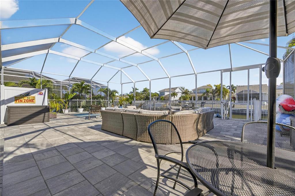 5721 Sea Turtle Place Apollo Beach, FL 33572 - Photo 55 of 80 a view of a patio with table and chairs under an umbrella