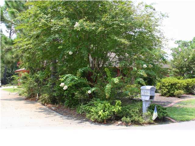 402 Olde Post Road Niceville, FL 32578 - Photo 11 of 13 a backyard of a house with a yard and fountain