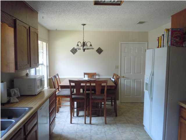 402 Olde Post Road Niceville, FL 32578 - Photo 3 of 13 a view of a dining room with furniture