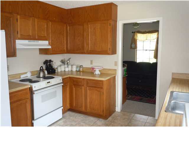 402 Olde Post Road Niceville, FL 32578 - Photo 4 of 13 a kitchen with a sink cabinets and a window
