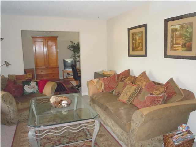402 Olde Post Road Niceville, FL 32578 - Photo 5 of 13 a living room with furniture and wooden floor