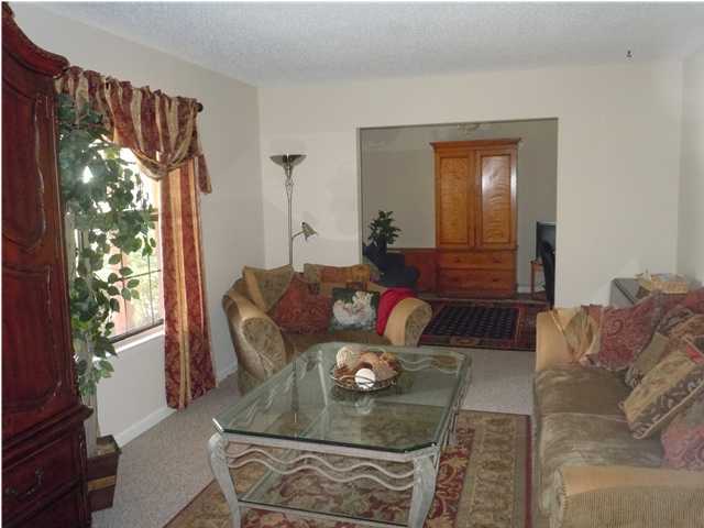 402 Olde Post Road Niceville, FL 32578 - Photo 6 of 13 a living room with furniture and a large window