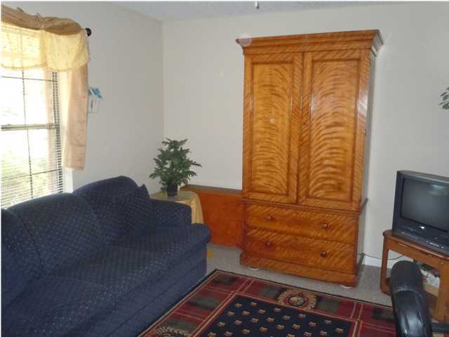 402 Olde Post Road Niceville, FL 32578 - Photo 7 of 13 a room with furniture and a flat screen tv