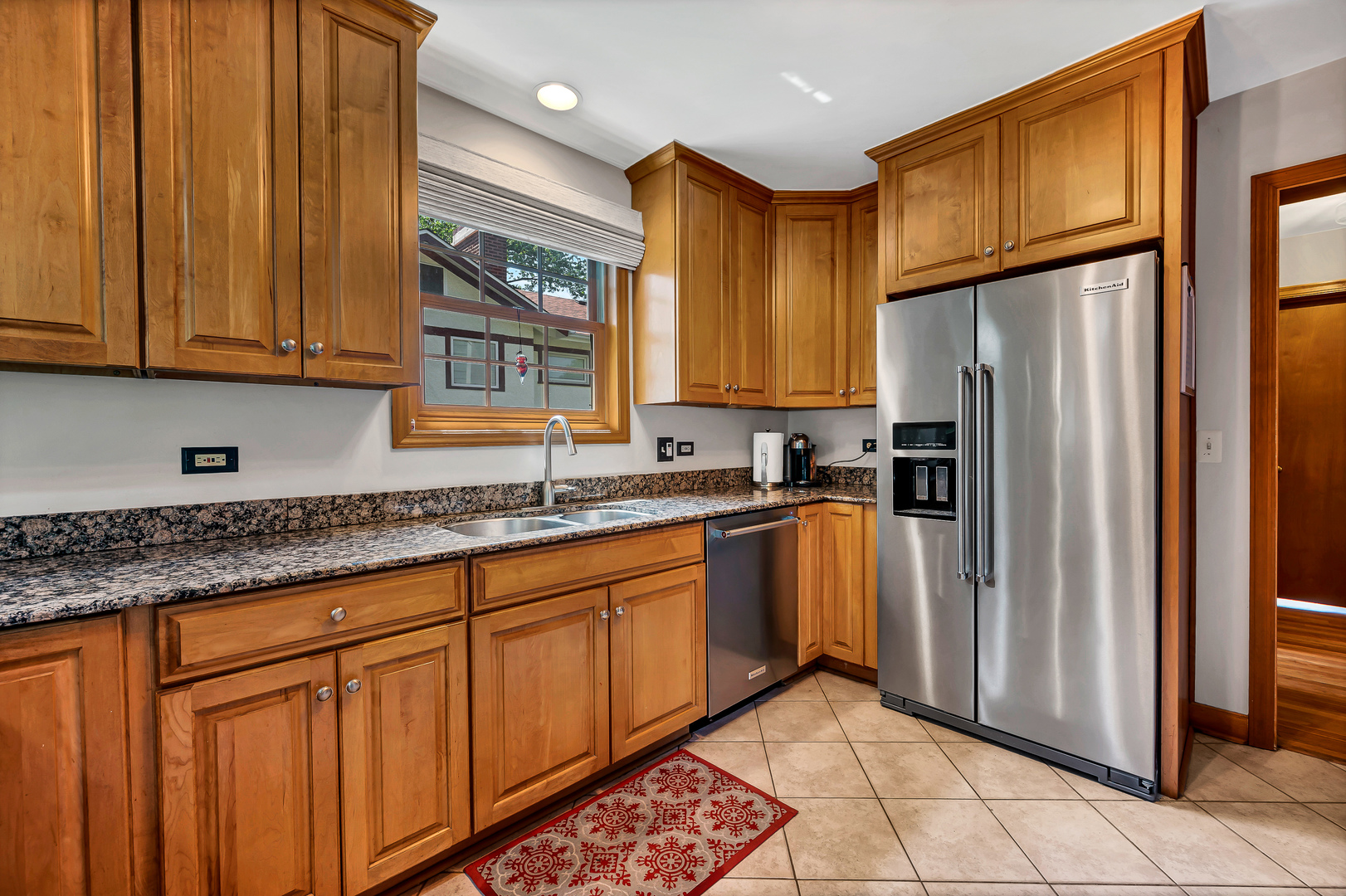 100 South Herbert Road Riverside, IL 60546 - Photo 11 of 30 a kitchen with stainless steel appliances granite countertop a refrigerator a sink and dishwasher