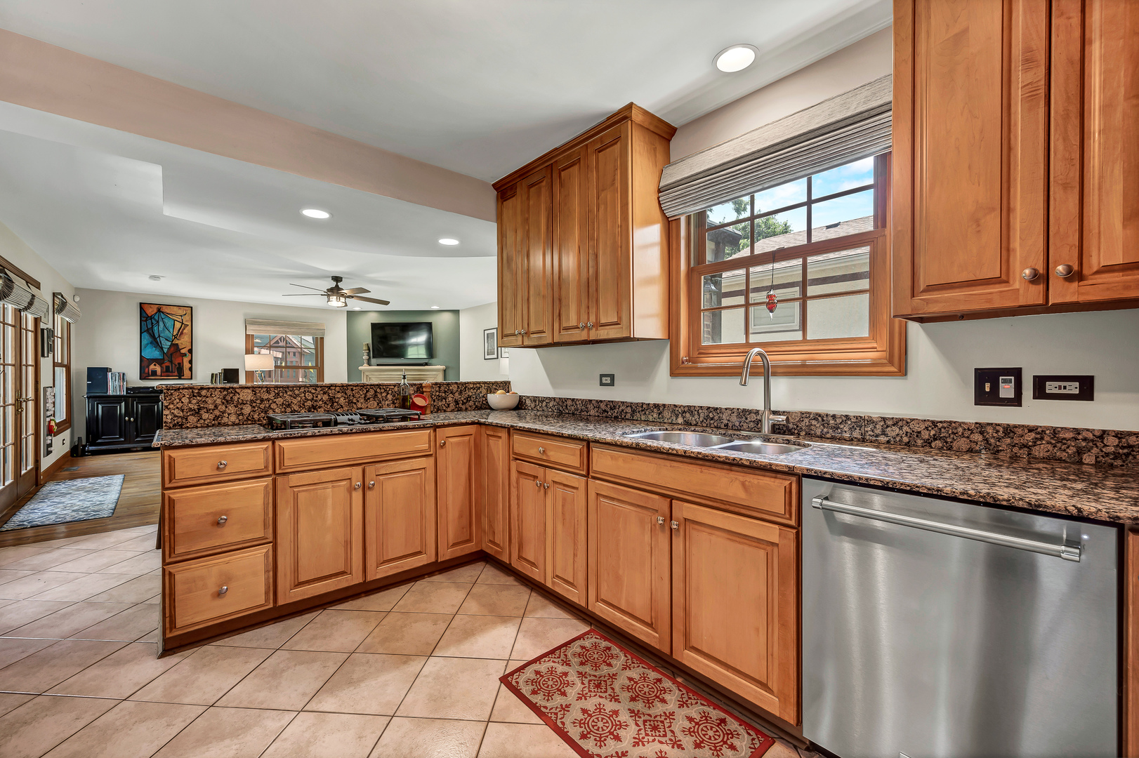 100 South Herbert Road Riverside, IL 60546 - Photo 12 of 30 a kitchen with stainless steel appliances granite countertop a sink and cabinets