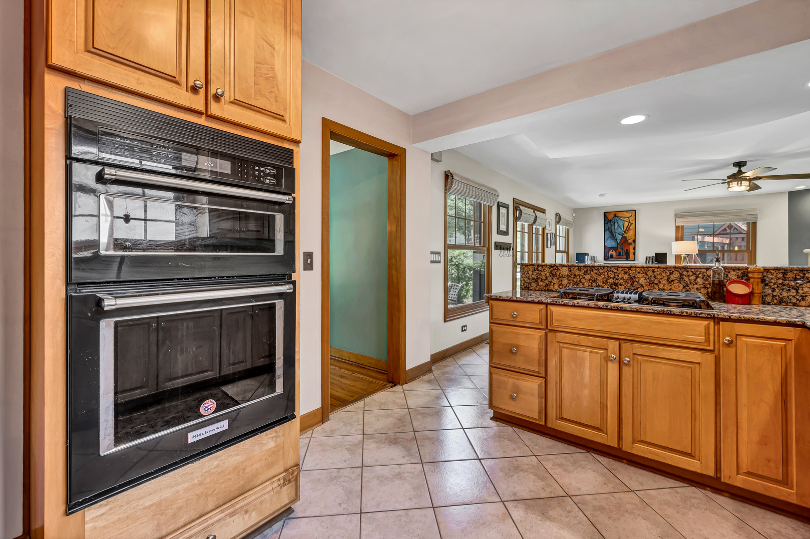 100 South Herbert Road Riverside, IL 60546 - Photo 13 of 30 a kitchen with granite countertop a stove top oven and cabinets