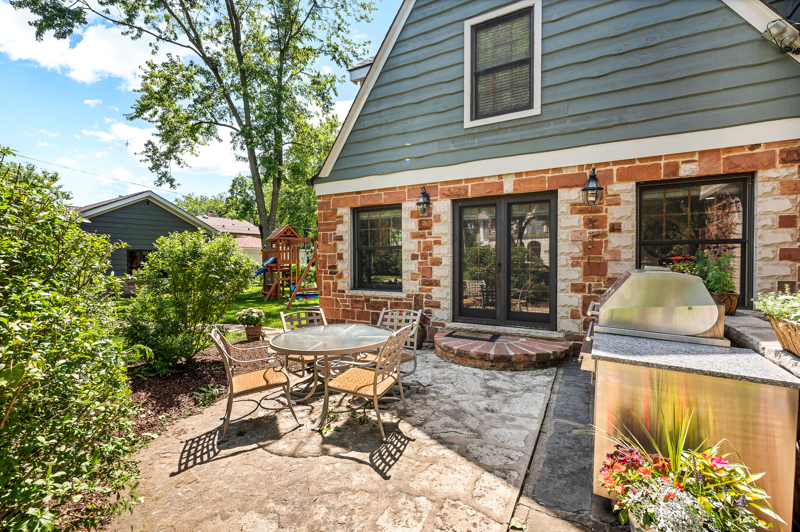 100 South Herbert Road Riverside, IL 60546 - Photo 2 of 30 a view of a house with backyard sitting area and porch
