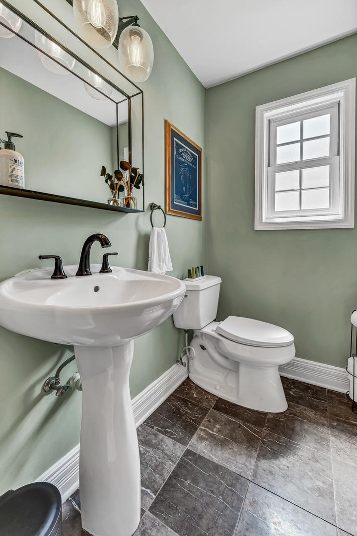 100 South Herbert Road Riverside, IL 60546 - Photo 29 of 30 a bathroom with a sink a toilet and mirror