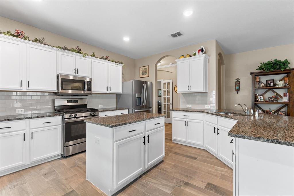300 Copper Switch Drive Anna, TX 75409 - Photo 7 of 26 Large open kitchen with island