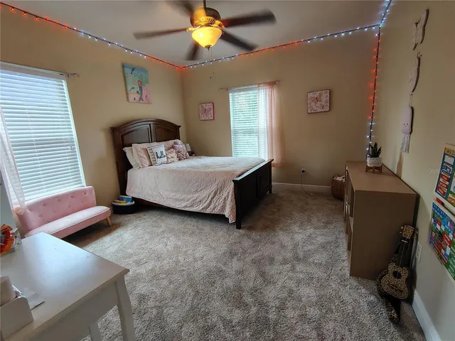 a bed room with a bed and a window