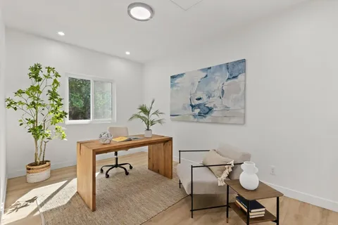 a view of a workspace with furniture