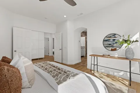 a bedroom with a bed and a dresser