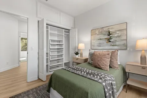 a bedroom with a bed and a lamp