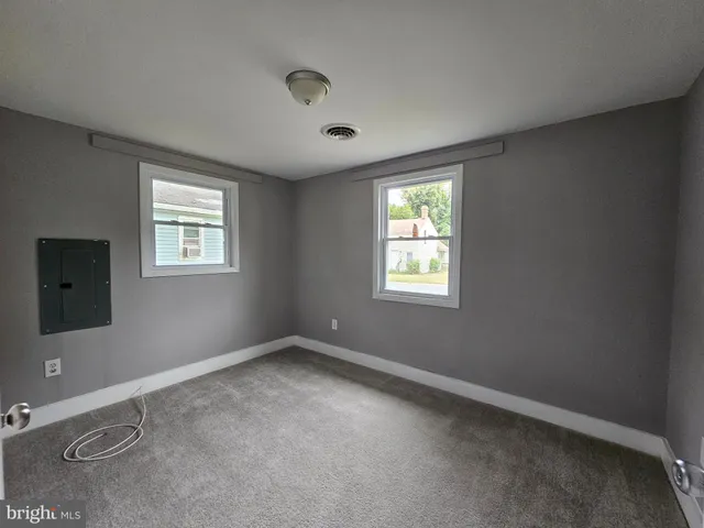 an empty room with windows