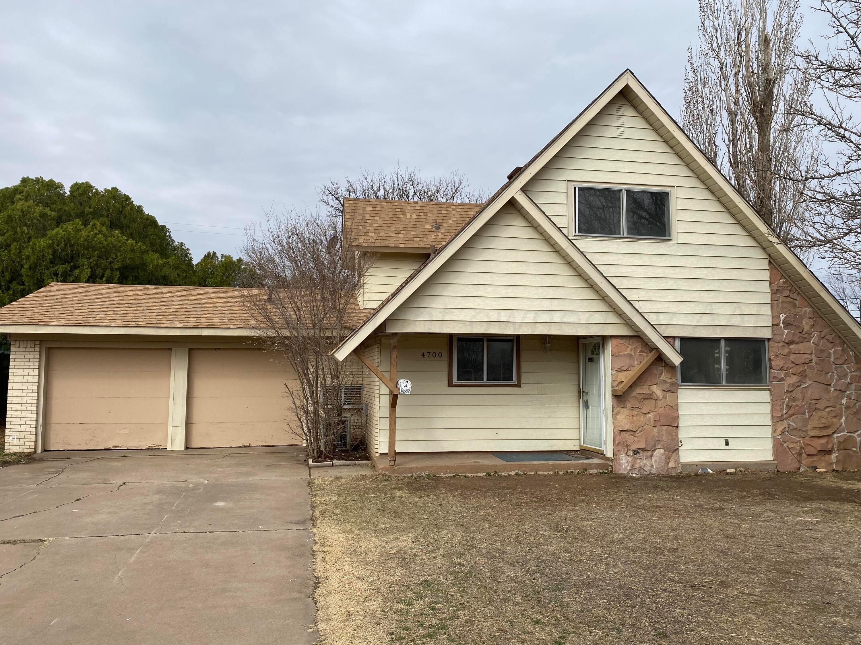 a front view of a house with a garage