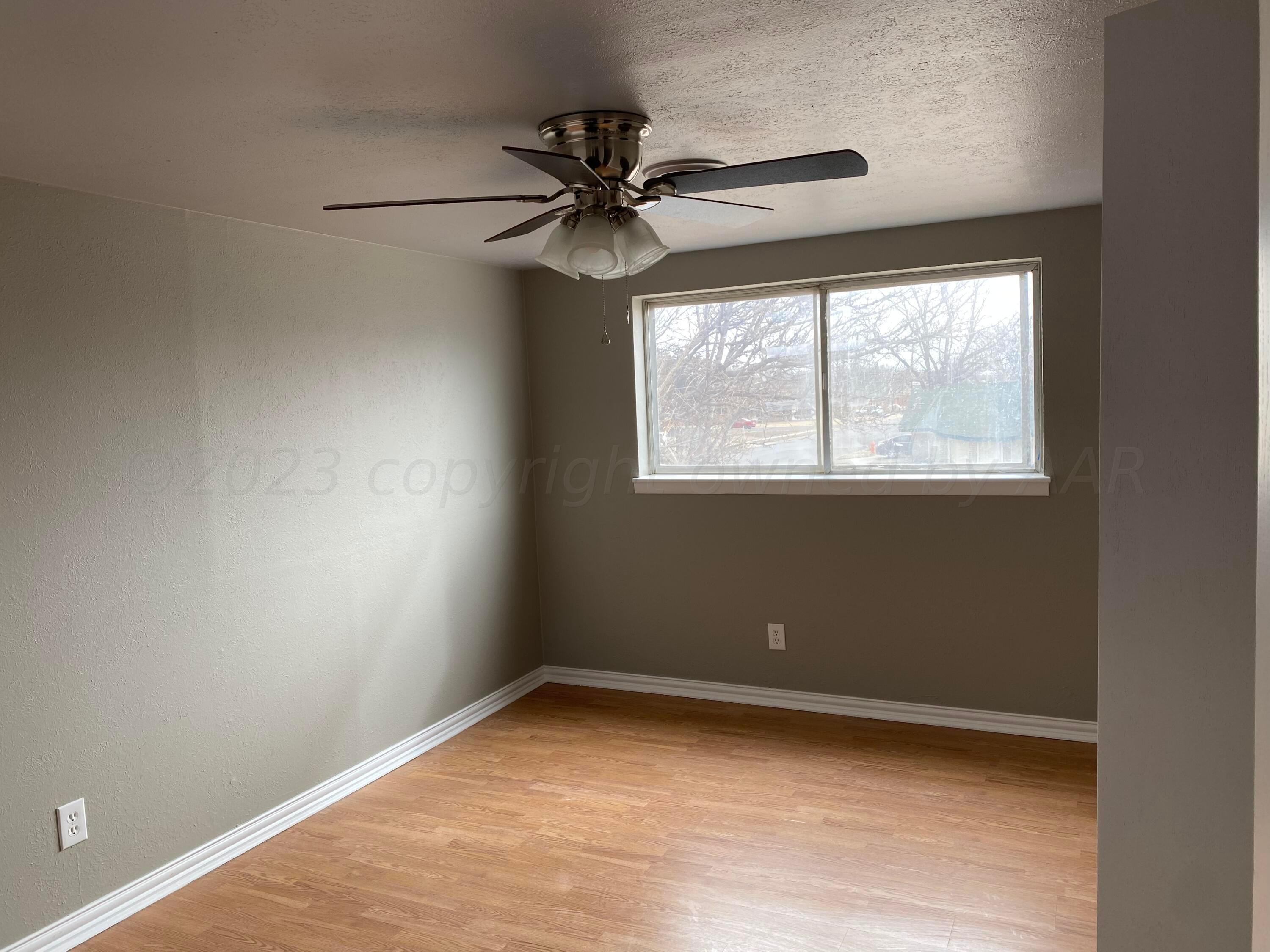 4700 Oregon Trail Amarillo, TX 79109 - Photo 8 of 9 an empty room with a window