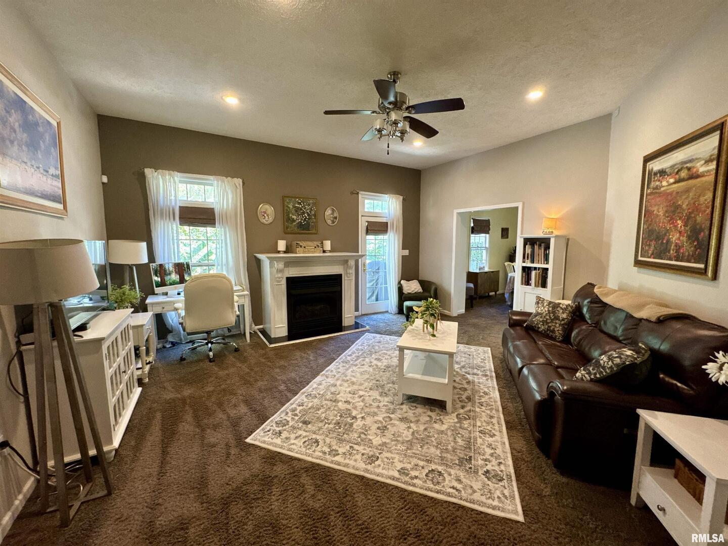 1801 Colonial Drive Marion, IL 62959 - Photo 11 of 45 a living room with furniture windows and a fireplace