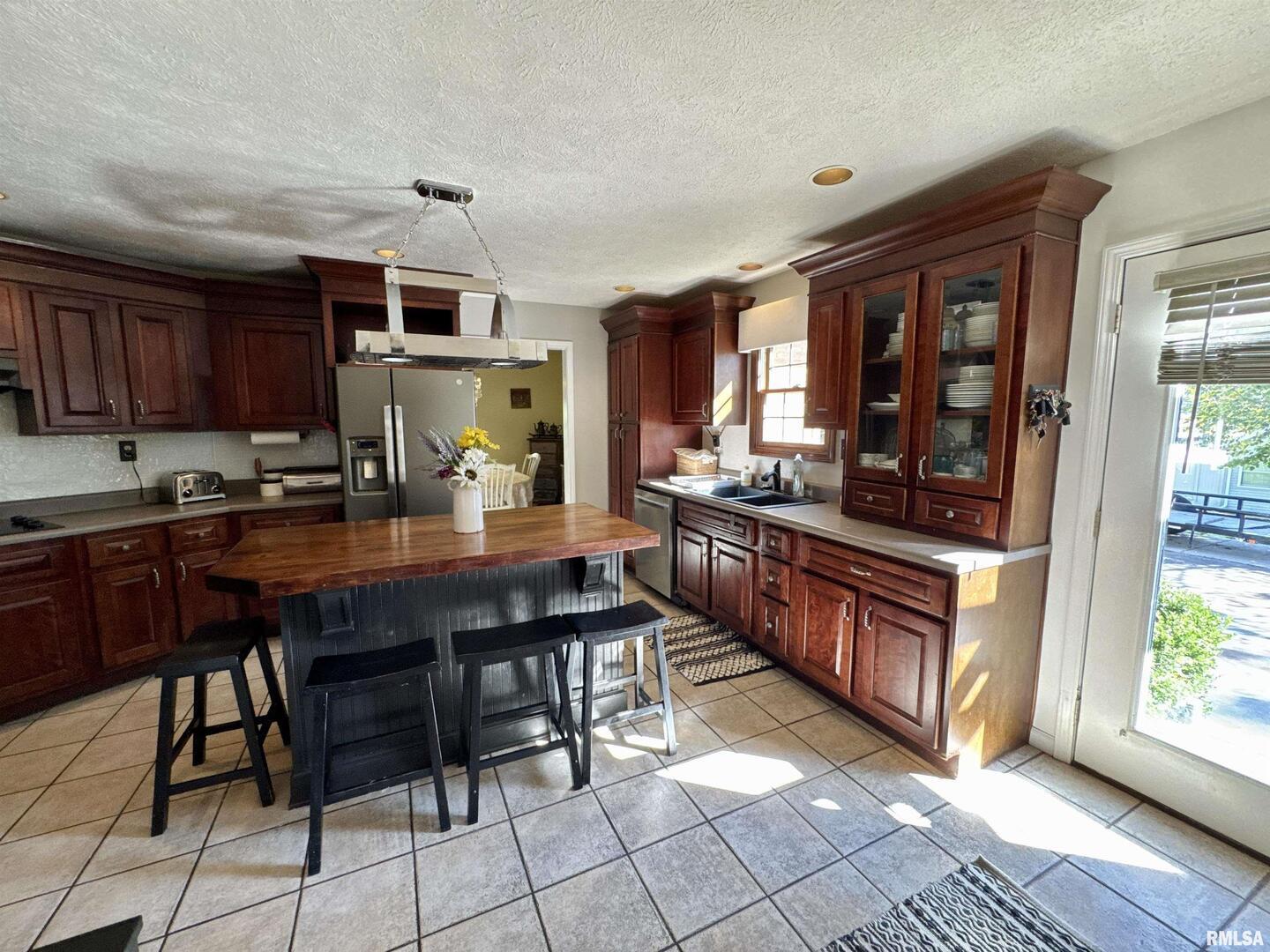 1801 Colonial Drive Marion, IL 62959 - Photo 14 of 45 a kitchen with stainless steel appliances granite countertop a stove a sink dishwasher and cabinets with wooden floor