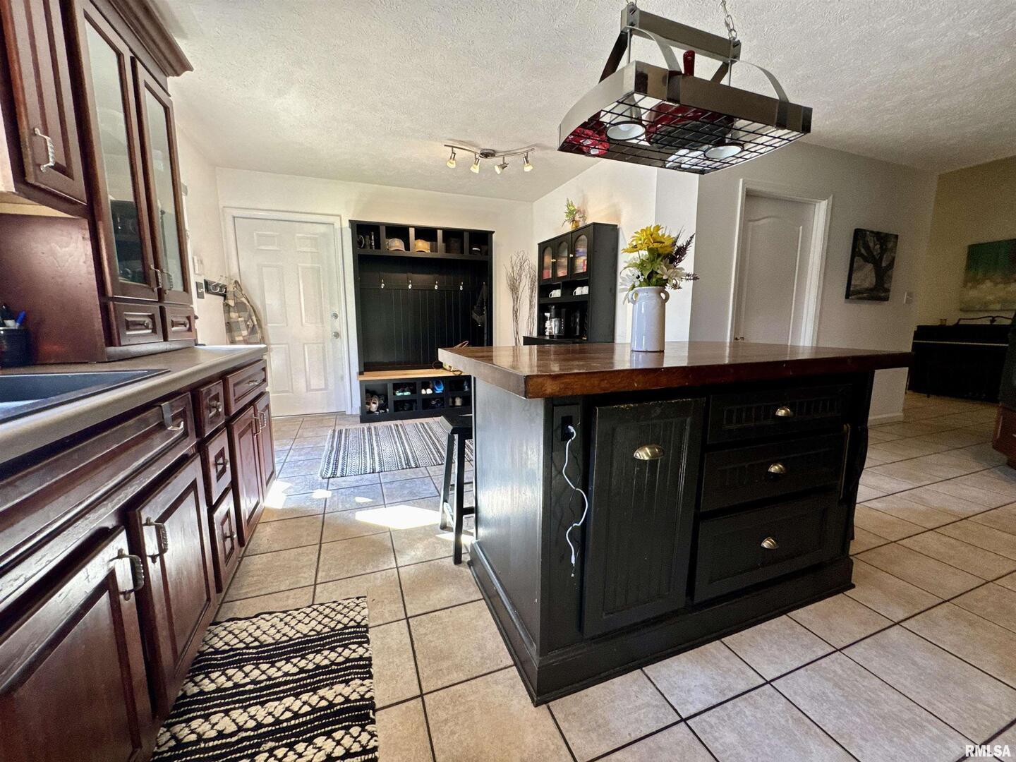 1801 Colonial Drive Marion, IL 62959 - Photo 16 of 45 a kitchen with stainless steel appliances granite countertop a stove a sink and a microwave