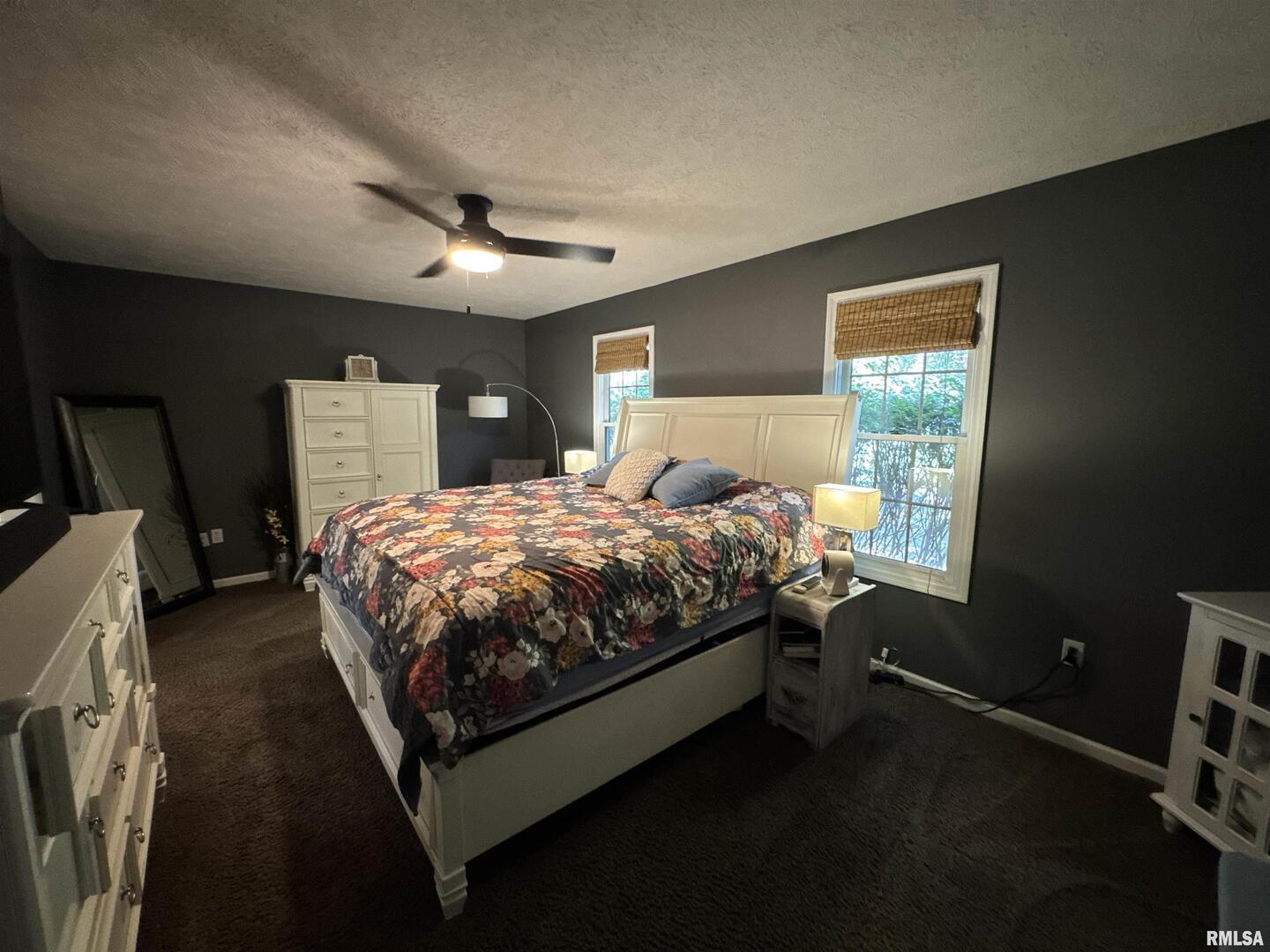 1801 Colonial Drive Marion, IL 62959 - Photo 19 of 45 a bed sitting in a bedroom next to a window