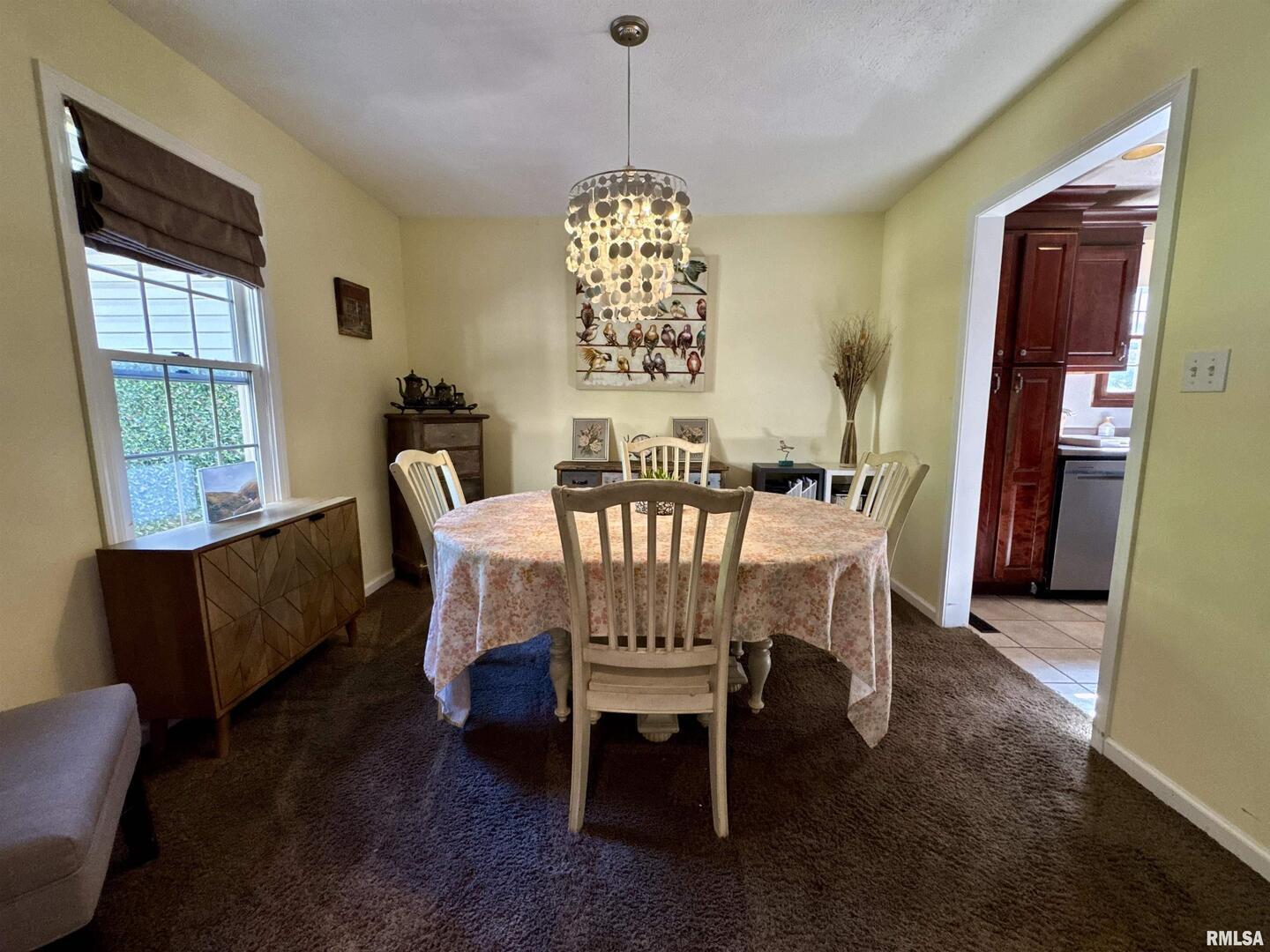 1801 Colonial Drive Marion, IL 62959 - Photo 25 of 45 a dining room with furniture a chandelier and wooden floor