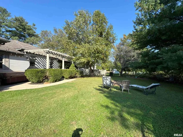 a view of a yard with a tree