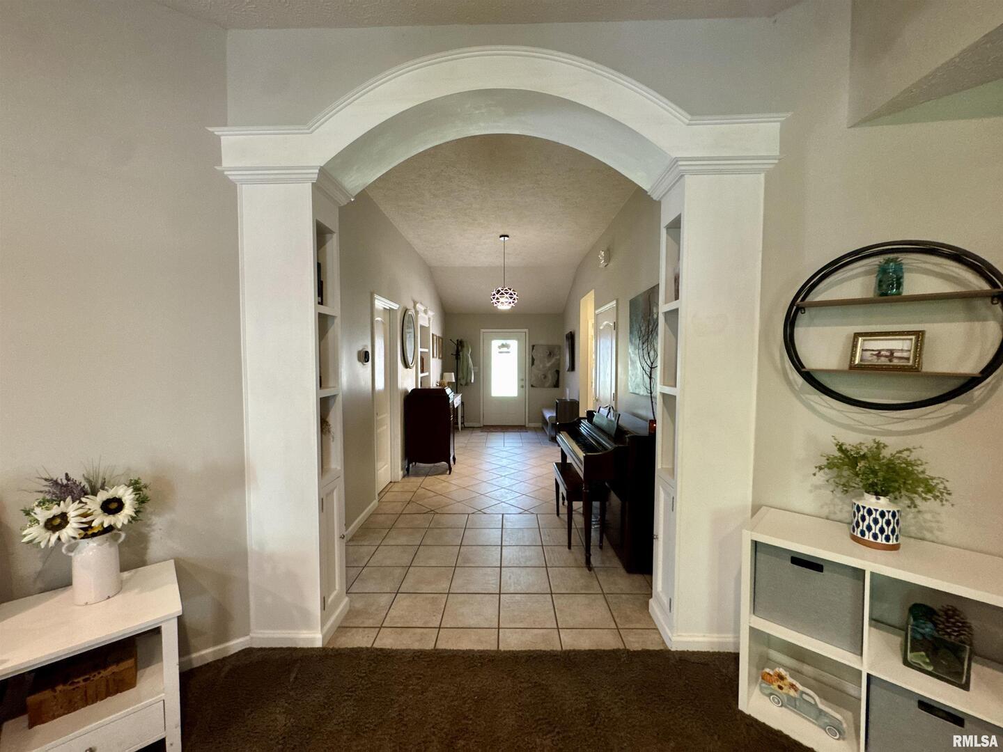 1801 Colonial Drive Marion, IL 62959 - Photo 4 of 45 a view of a hallway with living room and furniture