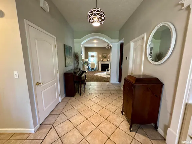 a living room with a furniture and a large window