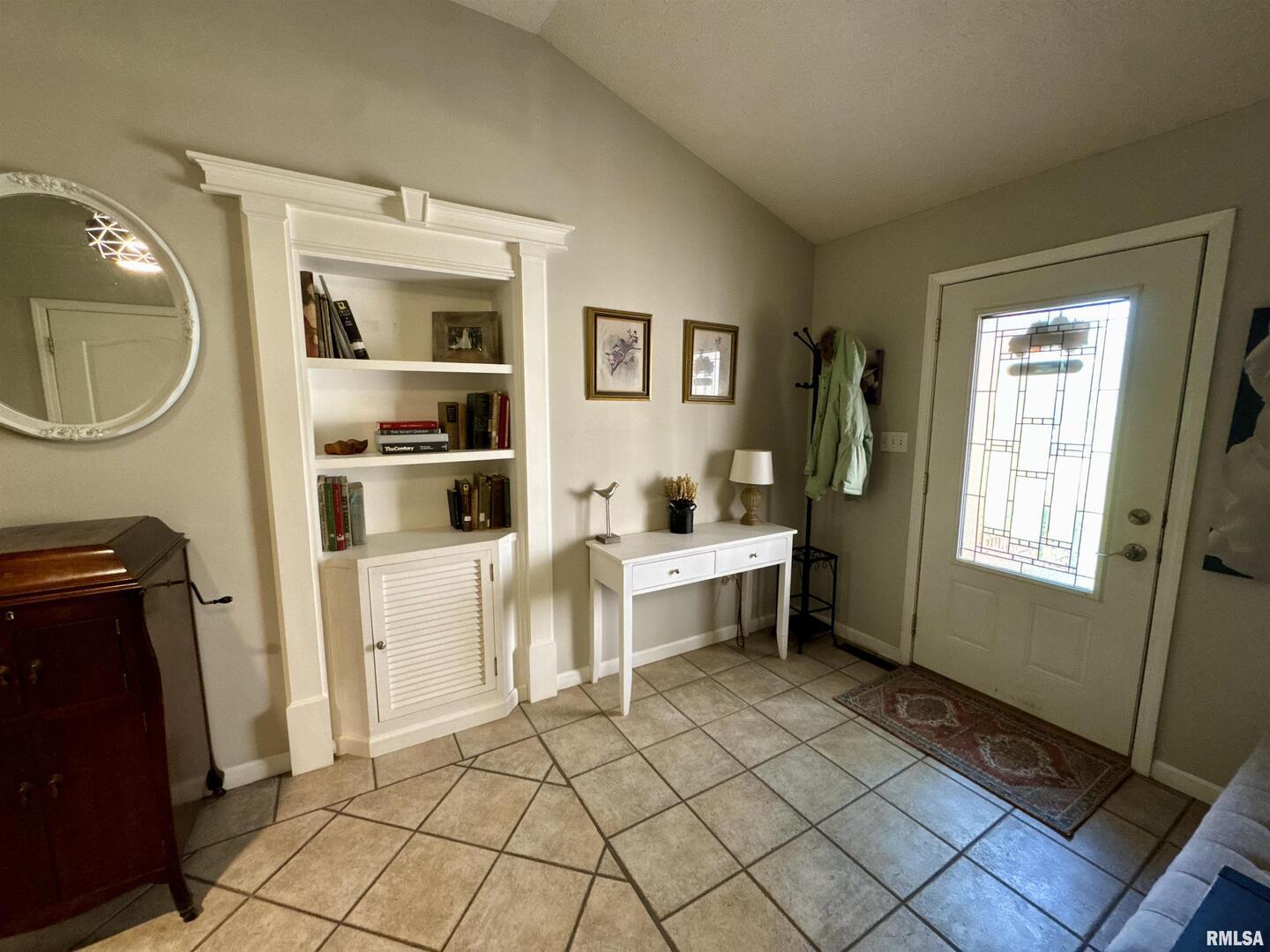 1801 Colonial Drive Marion, IL 62959 - Photo 7 of 45 a room with a chair and cabinets