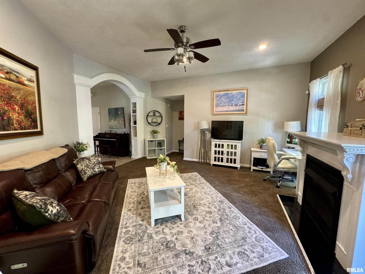 1801 Colonial Drive Marion, IL 62959 - Photo 10 of 45 a living room with furniture fireplace and window
