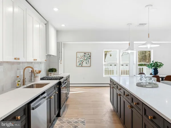 a kitchen with a table and chairs in it