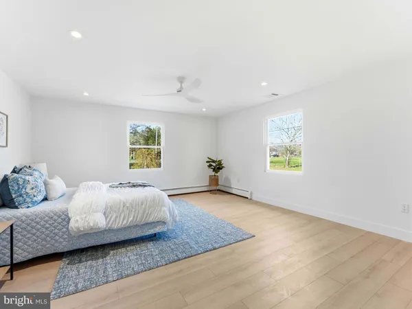 a bathroom with a shower sink and mirror