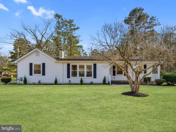 a large house with a large pool in front of it