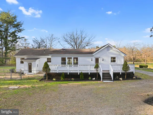 a view of an empty room with stairs