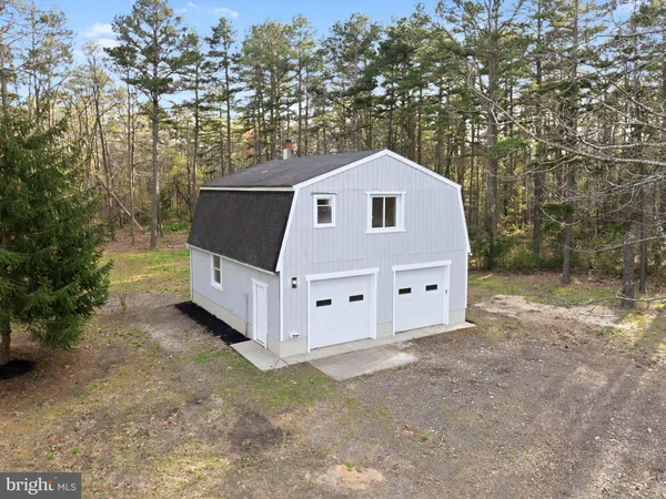 a aerial view of a house with a yard