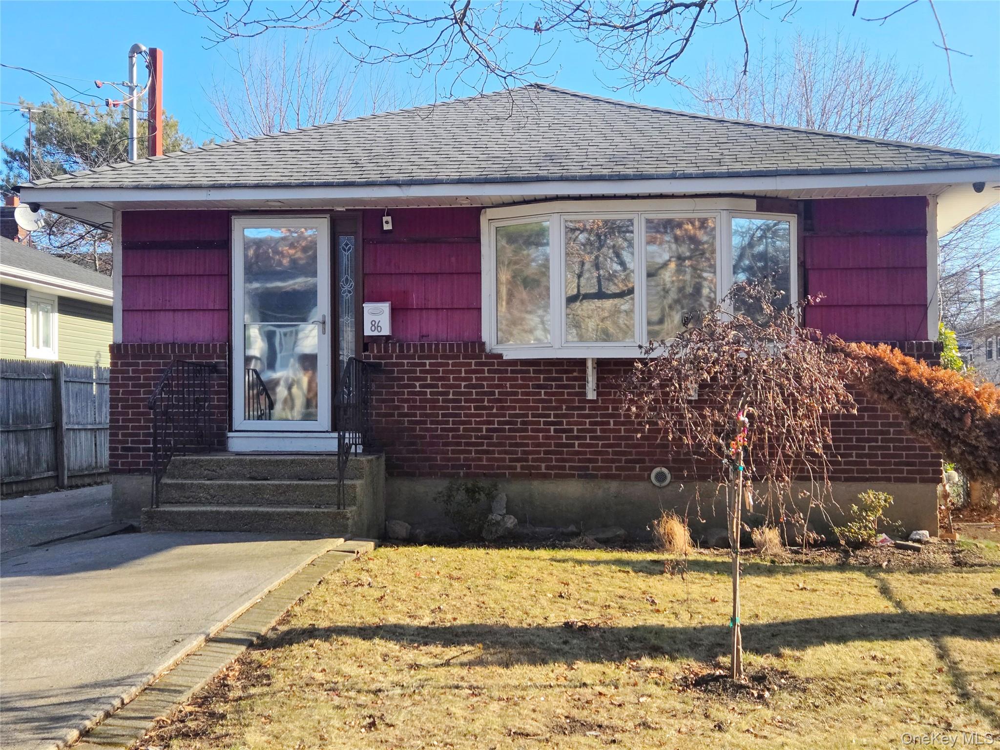 a front view of a house having yard