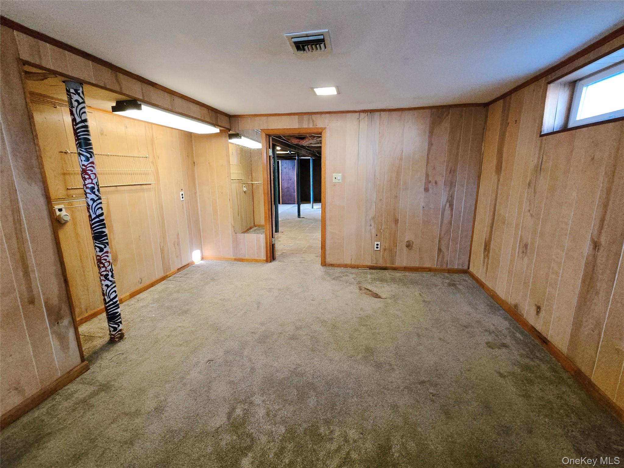 86 Decatur Street Roosevelt, NY 11575 - Photo 27 of 30 a view of an empty room