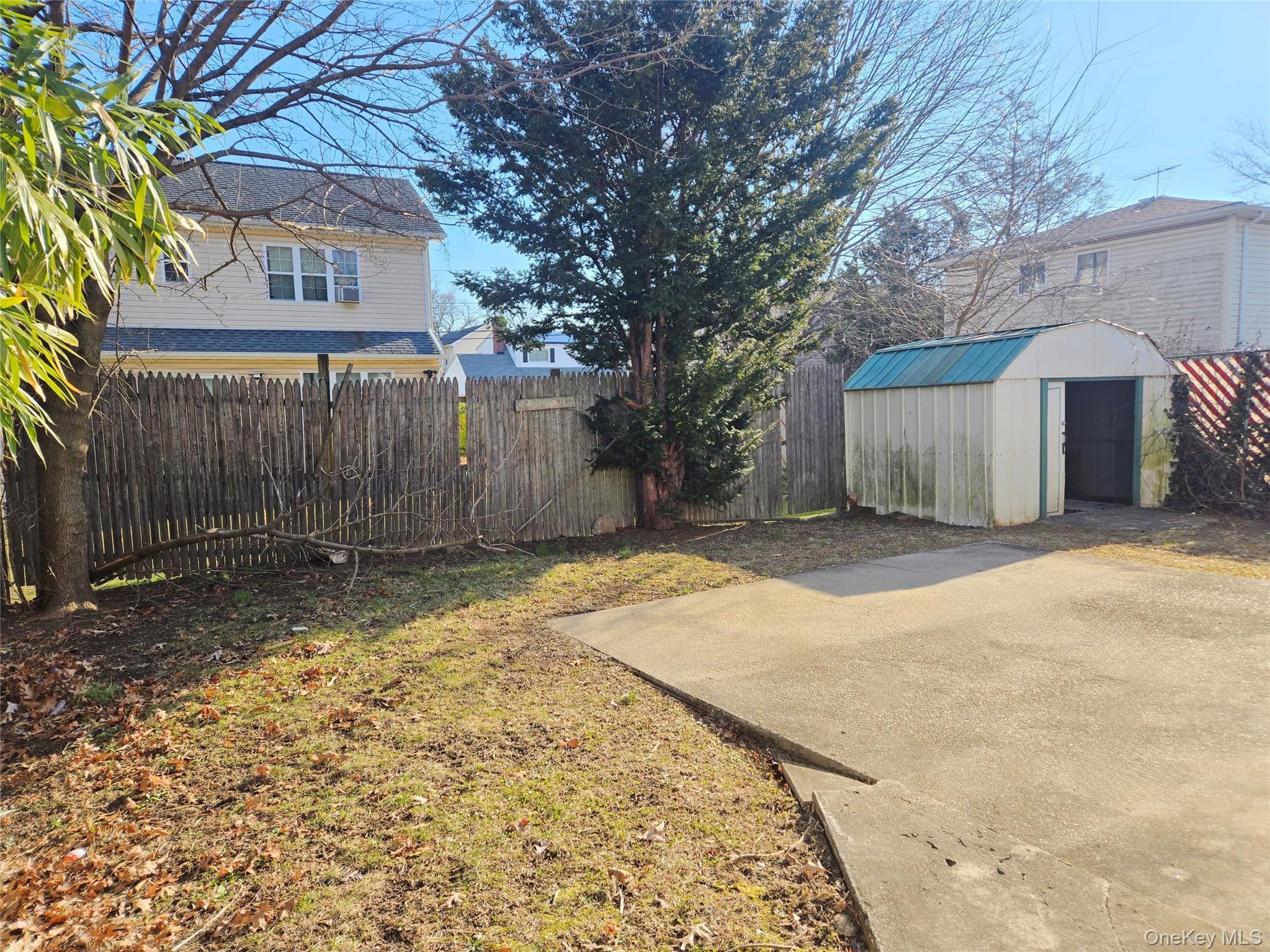 86 Decatur Street Roosevelt, NY 11575 - Photo 5 of 30 a view of a house with a yard