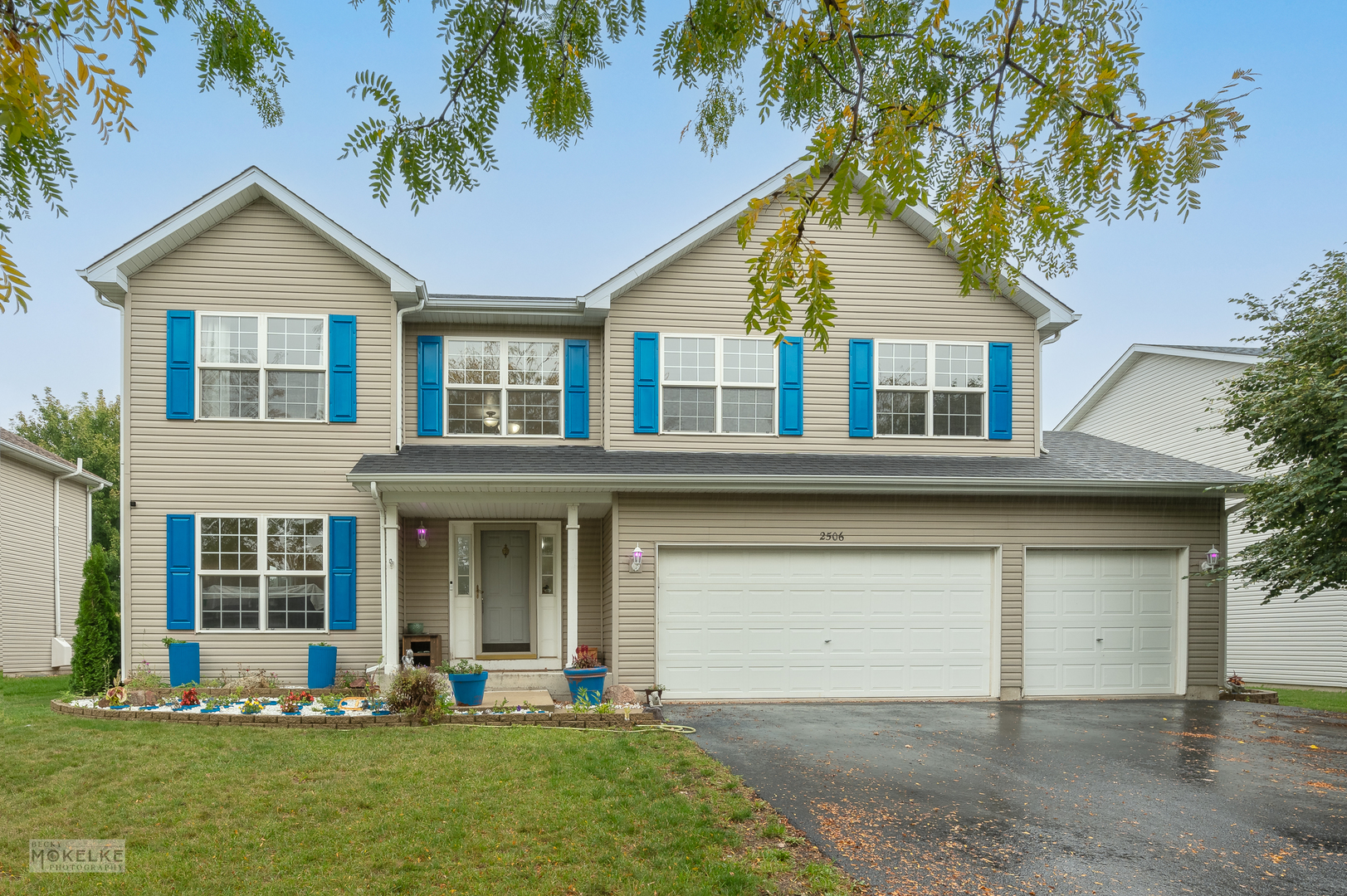 front view of a house with a yard