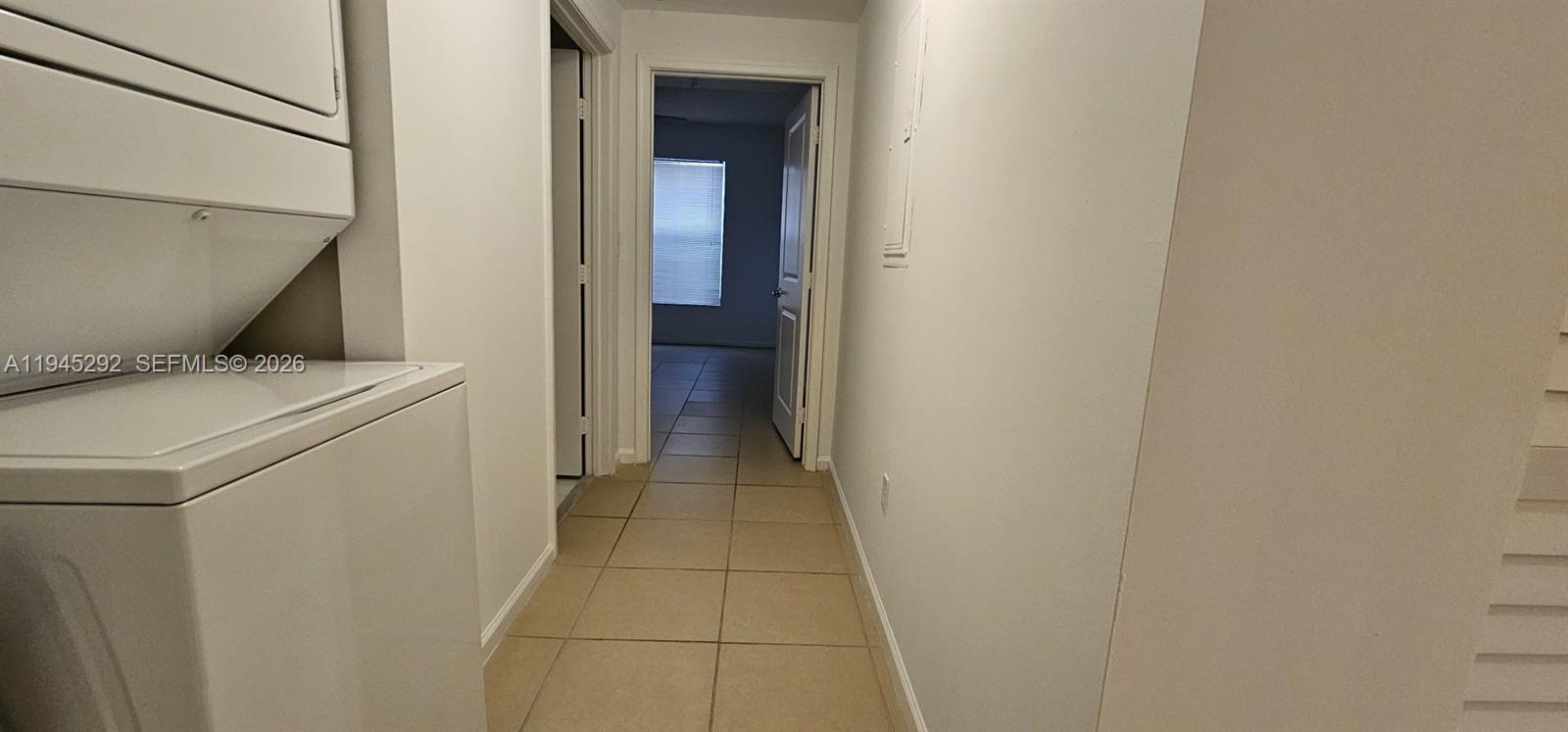 5800 West Sample Road, Unit 103 Coral Springs, FL 33067 - Photo 16 of 18 a utility room with dryer and washer