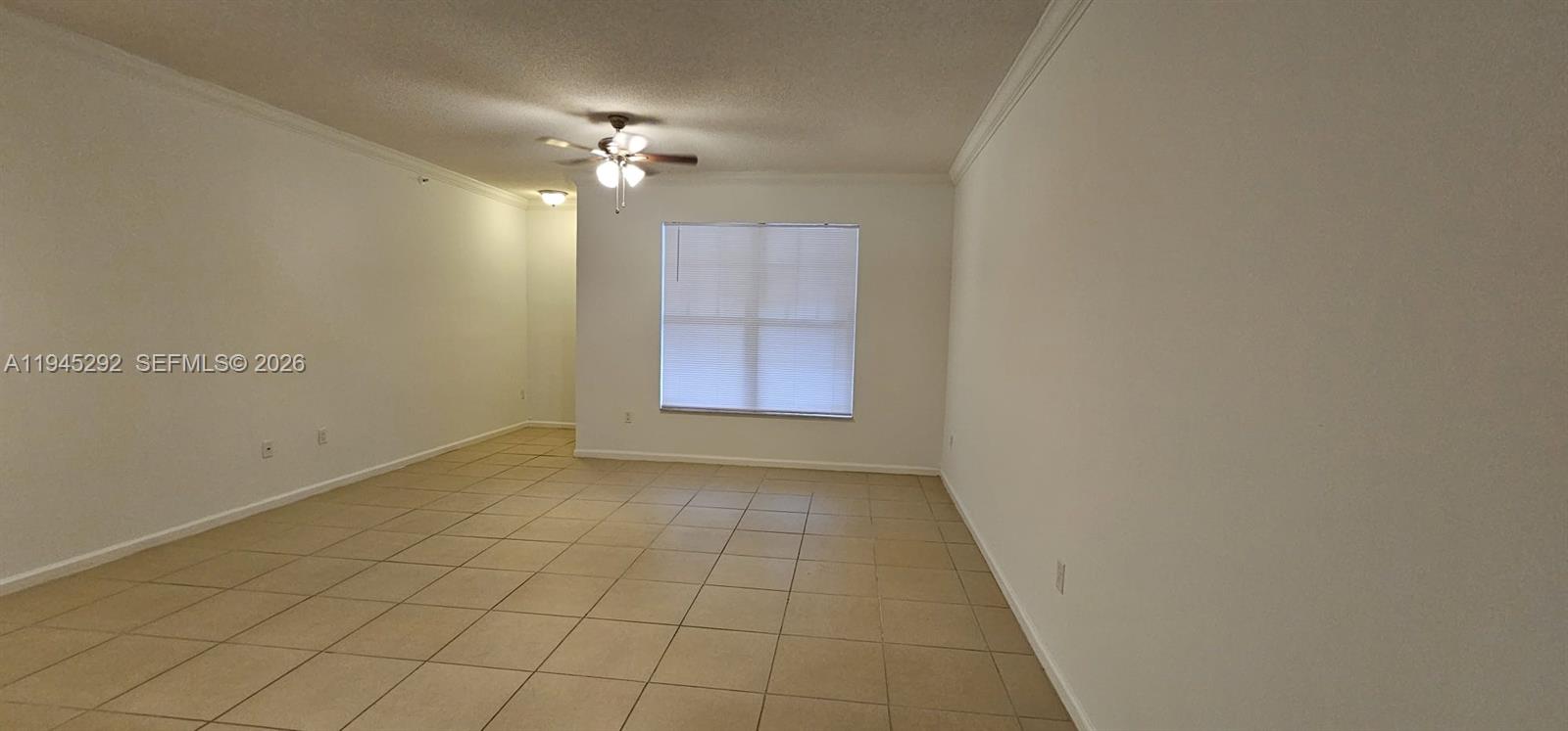 5800 West Sample Road, Unit 103 Coral Springs, FL 33067 - Photo 2 of 18 a view of an empty room with a window