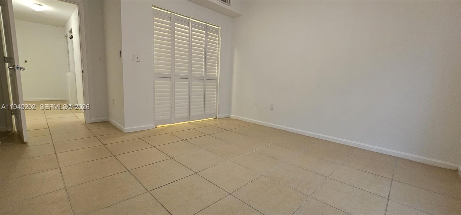 5800 West Sample Road, Unit 103 Coral Springs, FL 33067 - Photo 4 of 18 wooden floor in a empty room