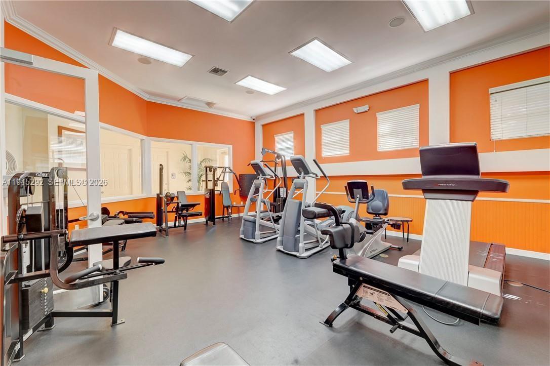 5800 West Sample Road, Unit 103 Coral Springs, FL 33067 - Photo 8 of 18 a view of a room with gym equipment