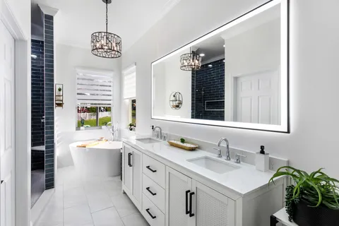 a bathroom with a sink a vanity and a mirror