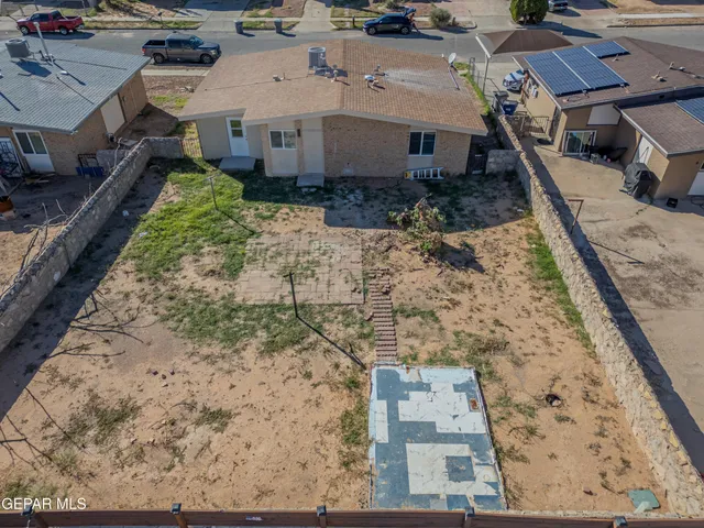 an aerial view of a house with outdoor space