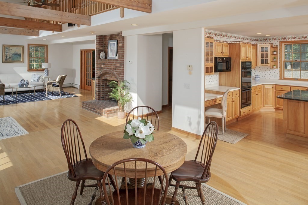 93 Beach Road Orleans, MA 02653 - Photo 11 of 28 a view of a dining room with furniture window and wooden floor
